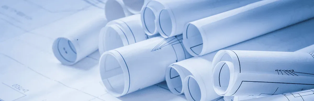 A stack of rolled up blueprints.