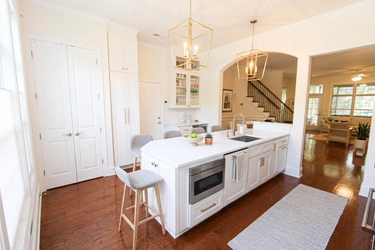 White kitchen remodel with gold light fixtures 2.2